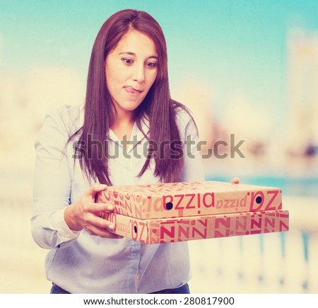 woman holding pizza boxes