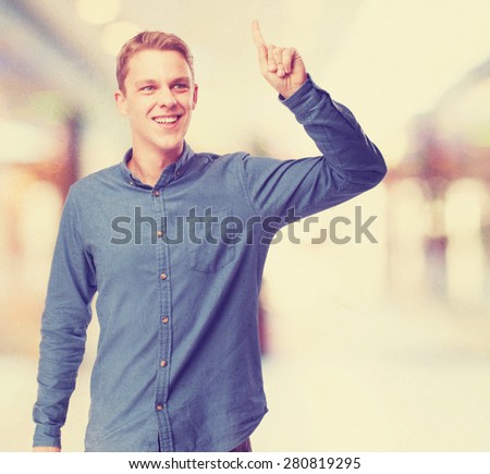 happy young-man pointing up