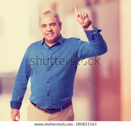 man pointing up with finger