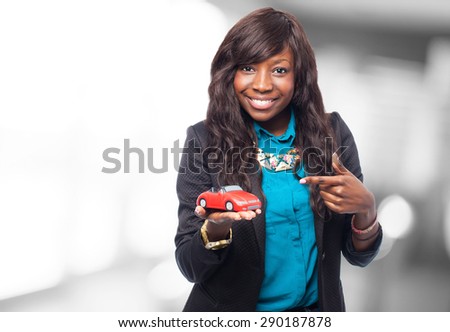 cool black woman with red car