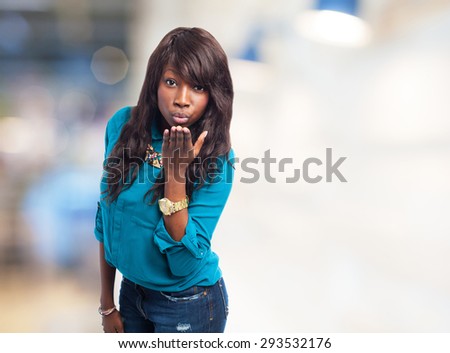 black woman sending a kiss