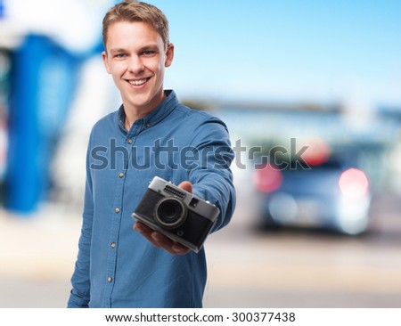happy young-man with camera