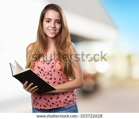 young student reading a book on white background