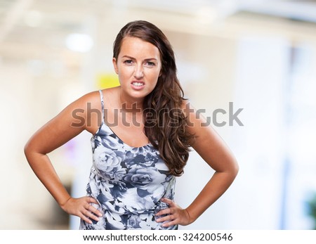 angry young woman on white background