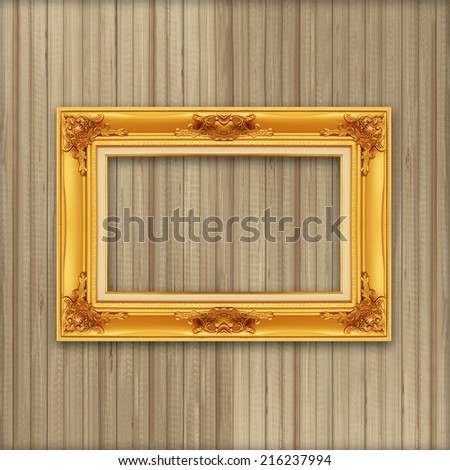 gold frame on the Wood wall background