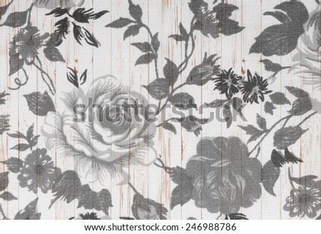 rose vintage from fabric on white wooden background.