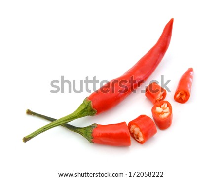 Sliced fresh red chillies isolated on a white background.