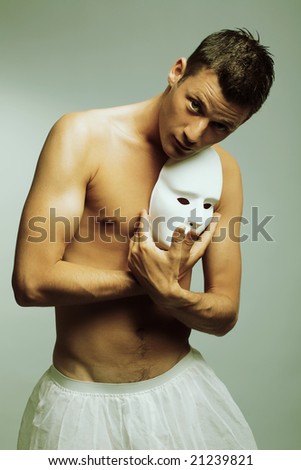 man with mask. cross-processed fashion art photo.