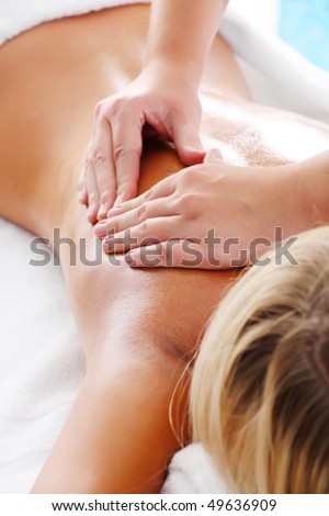 Massage Techniques III - woman receiving professional massage.