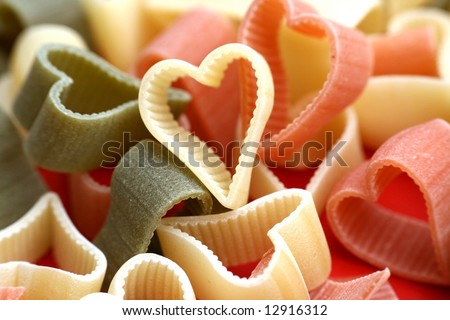 Abstract valentine or food background with uncooked noodles n diffrent colors looks like hearts Stock fotó © 
