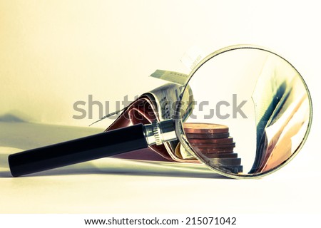 magnifying money photo with money and magnifying glass