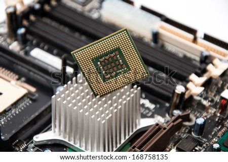Desktop motherboard with CPU on a white background