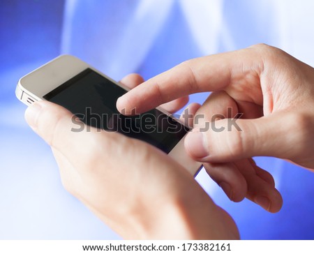 Close up of male hands touching mobile smart phone