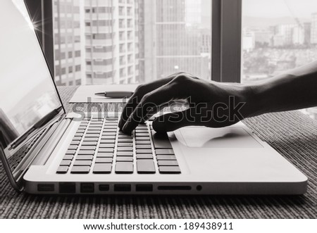 Business person using computer at the office.