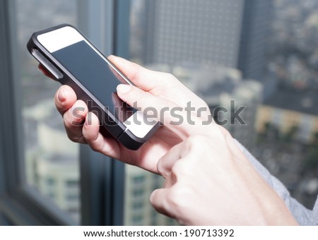 Business woman using mobile smart phone.