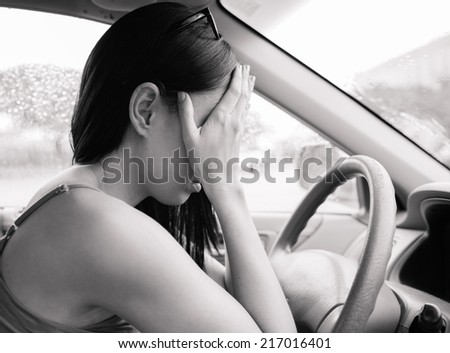Transportation concept - Stressed woman driver