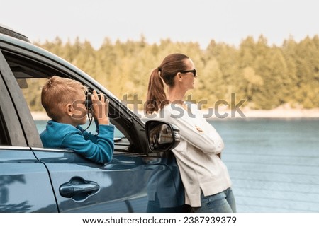 Similar – Image, Stock Photo Car stoped on the road with view of typical rural Icelandic Church with red roof in Vik region. Iceland