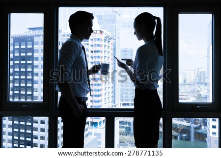 Two business people in a office setting.