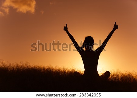 Woman celebrating in a beautiful setting.