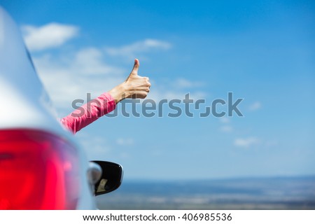 Similar – Image, Stock Photo Unrecognizable female traveler enjoying sunny day on rocky seashore