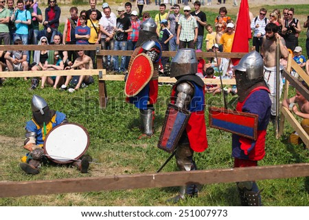 Armored knights on a battlefield on a medieval festival in Akkerman fortress - May 2, 2013, Belgorod-Dnestrovsky, Ukraine