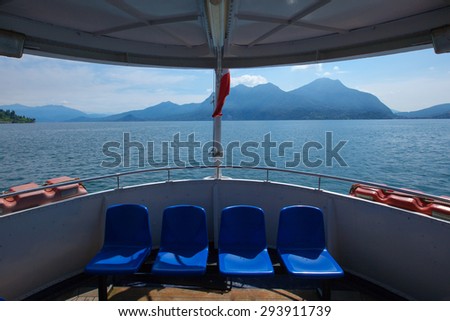 Blue seats on a ferry stern on Lake Maggiore, Italy