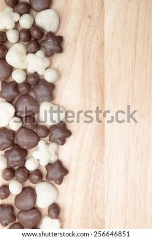 candy, chocolate on the background of wooden brown boards