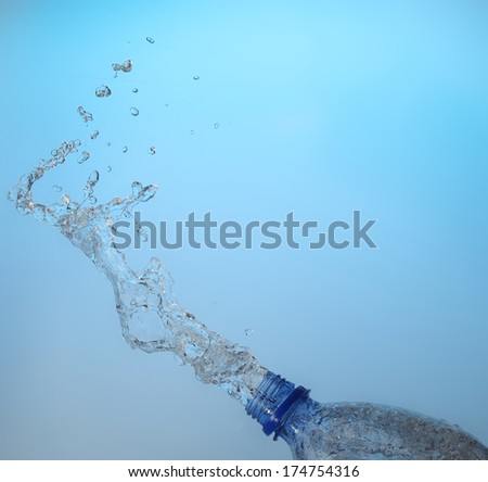 Flow of fresh water from a bottle formed a beautiful splashes of pure water