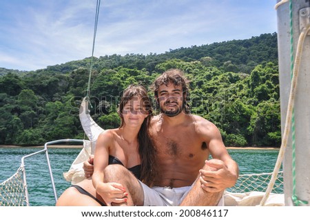 Cute Couple in love sailing through Paraty tropical islands. Brazil. Rio do Janeiro. South America, Latin American Culture.
