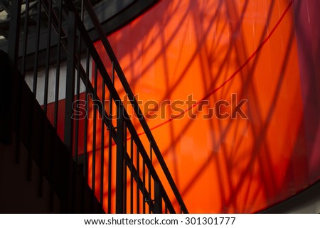 Abstract Shapes & Shadows on Red Wall Inside Building