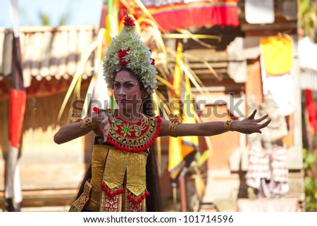 BALI, INDONESIA - APRIL 9: Young girl performs a classic national Balinese dance Barong on April 9, 2012 on Bali, Indonesia. Barong is very popular cultural show on Bali.