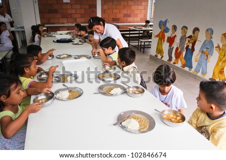 GUAYAQUIL, ECUADOR - FEBRUARY 8: Unknown children at lunch in the cafeteria after lessons by project to help deprived children in deprived areas with education, February 8, 2011 in Guayaquil, Ecuador.