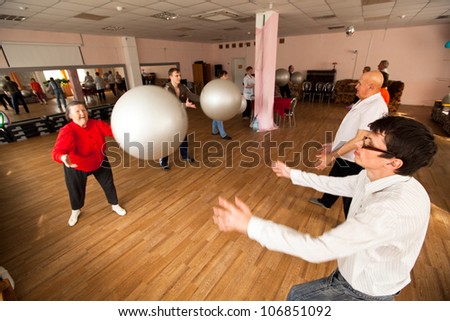 PODPOROZHYE, RUSSIA - JULY 5: Day of Health in Center of social services for pensioners and disabled Otrada (gymnastics with ball for eldery and disabled), July 5, 2012 in Podporozhye, Russia.