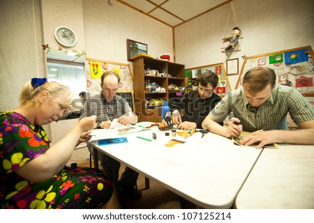 PODPOROZHYE, RUSSIA - JULY 3: Day of Health in Center of social services for pensioners and disabled Otrada (occupational therapy for eldery and disabled), July 3, 2012 in Podporozhye, Russia.