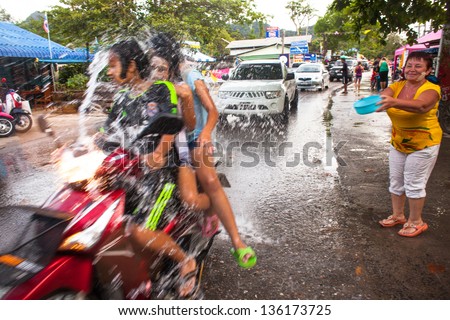 KO CHANG, THAILAND - APR 14: People celebrated Songkran Festival, on 14 Apr 2013 on Ko Chang, Thailand. Songkran is celebrated in Thailand as the traditional New Year by throwing water at each other.