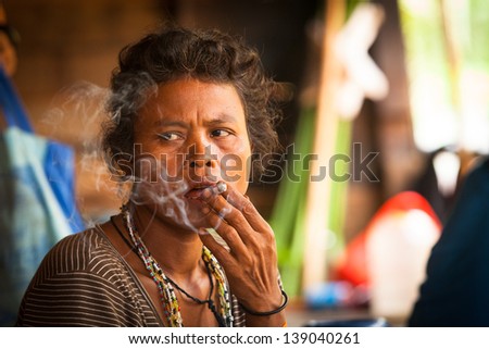 BERDUT, MALAYSIA - APR 8: Unidentified woman Orang Asli in his village on Apr 8, 2013 in Berdut, Malaysia. More than 76% of all Orang Asli live below the poverty line, life expectancy - 53 years old.