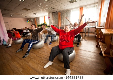 PODPOROZHYE, RUSSIA - OCT 11: Fitness training for elderly and disabled in program Day of Health in Center of social services for pensioners and disabled Otrada, Oct 11, 2012 in Podporozhye, Russia.