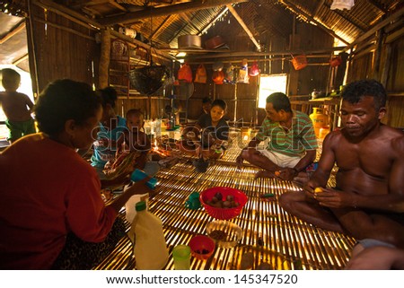 BERDUT, MALAYSIA - APR 8: Unidentified people Orang Asli in his house on Apr 8, 2013 in Berdut, Malaysia. More than 76% of all Orang Asli live below the poverty line, life expectancy - 53 years old.