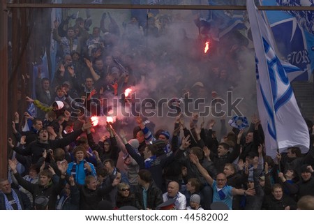 TOMSK, RUSSIA - APRIL 5: Fans of Football Club Zenit at the match Championship of Russia among Tom\'(Tomsk) - Zenit (Spb), April 5, 2009 in Tomsk, Russia.
