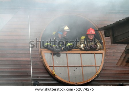 MOSCOW - APRIL 30: Firefighters extinguishing fire at the Viking floating restaurant on the Berezhkovskaya embankment, April 30, 2010 in Moscow, Russia.