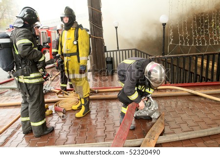 MOSCOW - APRIL 30: Firefighters extinguishing fire at the Viking floating restaurant on the Berezhkovskaya embankment, April 30, 2010 in Moscow, Russia.