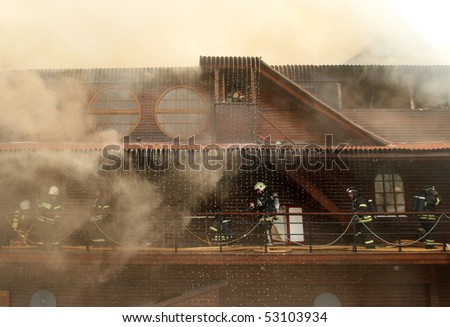 MOSCOW - APRIL 30: Firefighters extinguish fire at the Viking floating restaurant on the Berezhkovskaya embankment, April 30, 2010 in Moscow, Russia.