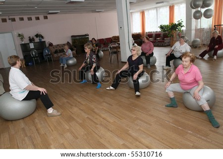 PODPOROZHYE, RUSSIA - JUNE 4: Day of Health in Center of social services for pensioners and the disabled Otrada (gymnastics with ball for elders), June 4, 2010 in Podporozhye, Russia.