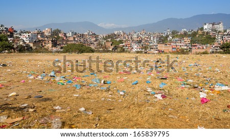 Debris on the field of view of panorama Kathmandu in the background. Environmental problems.