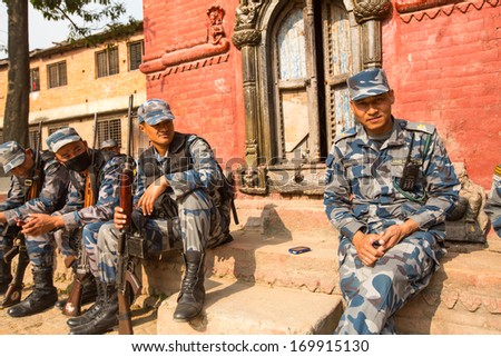 KATHMANDU, NEPAL - Oct 19: Unknown nepalese soldiers Armed Police Force near public school, Dec 19, 2013 in Kathmandu, Nepal. Initially founded with a roster of 15,000 police and military personnel.