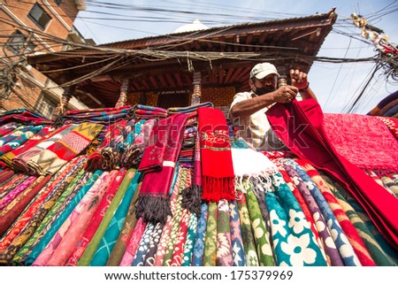 KATHMANDU, NEPAL - NOV 28: Unidentified street seller in historic center of city, Nov 28, 2013 in Kathmandu, Nepal. Largest city of Nepal, its economic center, a population of over 1 million people.