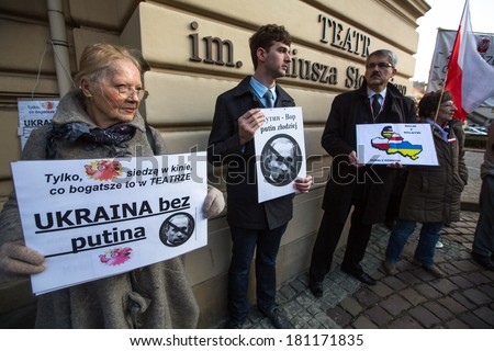 KRAKOW, POLAND - MAR 9, 2014: Unidentified participants during protest near Cracow Opera, against bringing Russian troops in the Crimea. Posters: Ukraine without Putin, and Putin - Thief.