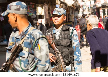 KATHMANDU, NEPAL - NOV 29, 2013: Soldiers during protest within a campaign to end violence against women (VAW). Held annually since 1991, 16 days Nov 25 - Dec 10.