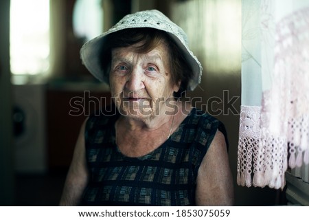 Similar – Image, Stock Photo Portrait of an old woman holding gardening tools while smiling to camera. Leisure time activities at home. Saving the planet plating plants. Planet concerns. Mature people works at home