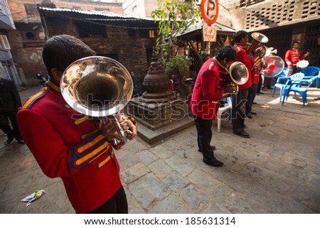 KATHMANDU, NEPAL - NOV 28, 2013: Unidentified musicians in traditional Nepalese wedding. Largest city of Nepal, its cultural center, a population of over 1 million people.